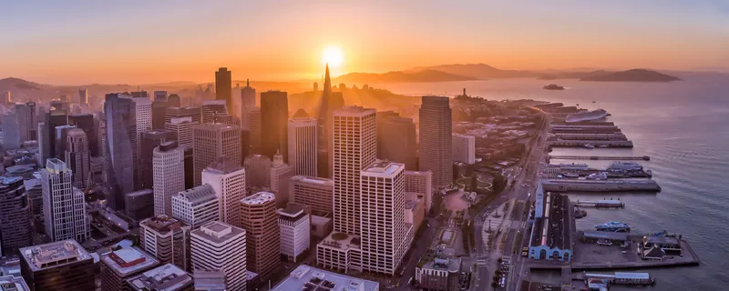 Downtown San Francisco and the Embarcadero piers from the air at sunset
